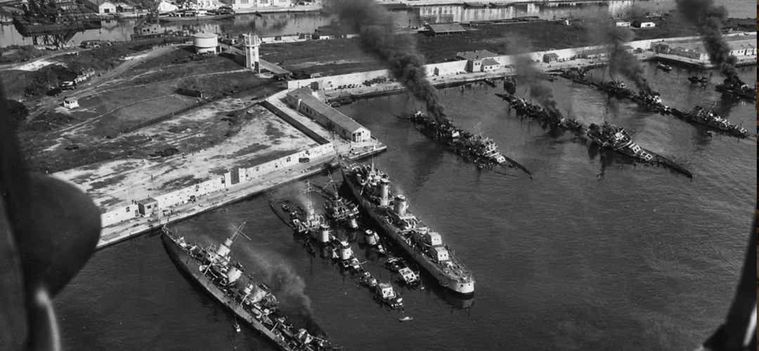 Aerial view illustrating the scuttling of the French fleet in the Port of Toulon on November 27, 1942. To prevent their warships from falling into German hands, French sailors deliberately sank much of the fleet, marking one of the most significant events in French naval history.